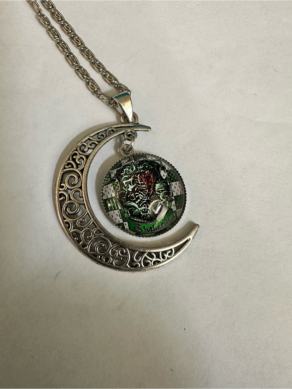 Harry Potter- Slytherin Silver Crescent Moon Necklace with Green Emblem Pendant